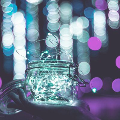 photo of glass jar with lights in the background